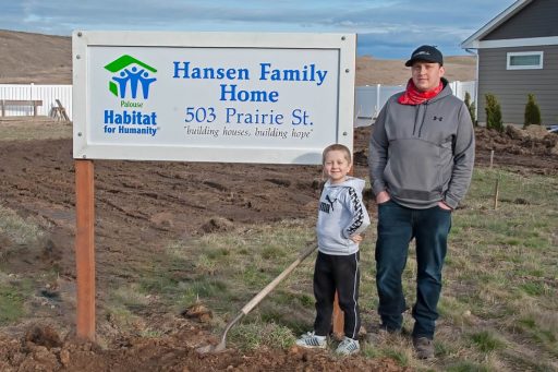 Kyle and Kyas Hansen By Their Build Site Sign