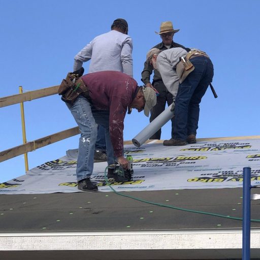 Volunteers Work on the Roof at the Build Site