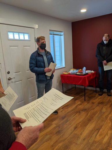 Volunteers bless the home at the Leaseburg Home Dedication Event