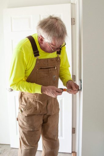 Volunteer Jim Fredenburg Triming out Light Switches at a build site.