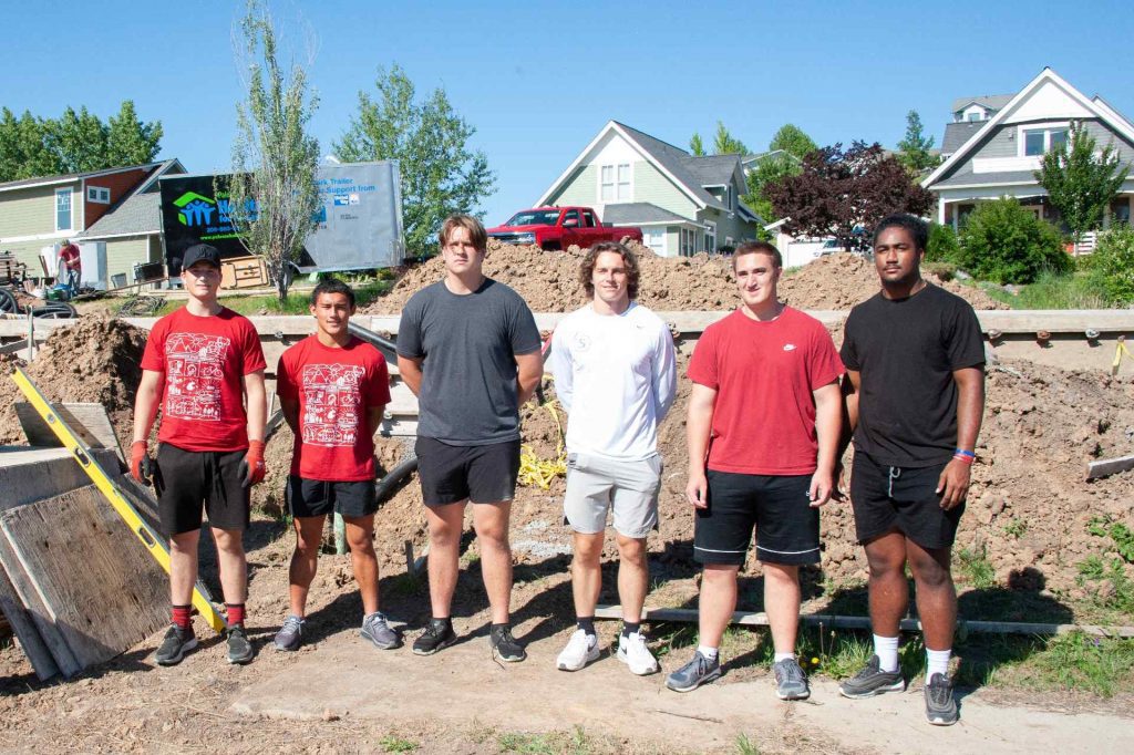 WSU Football Players Volunteering at a Build Site for PHFH.